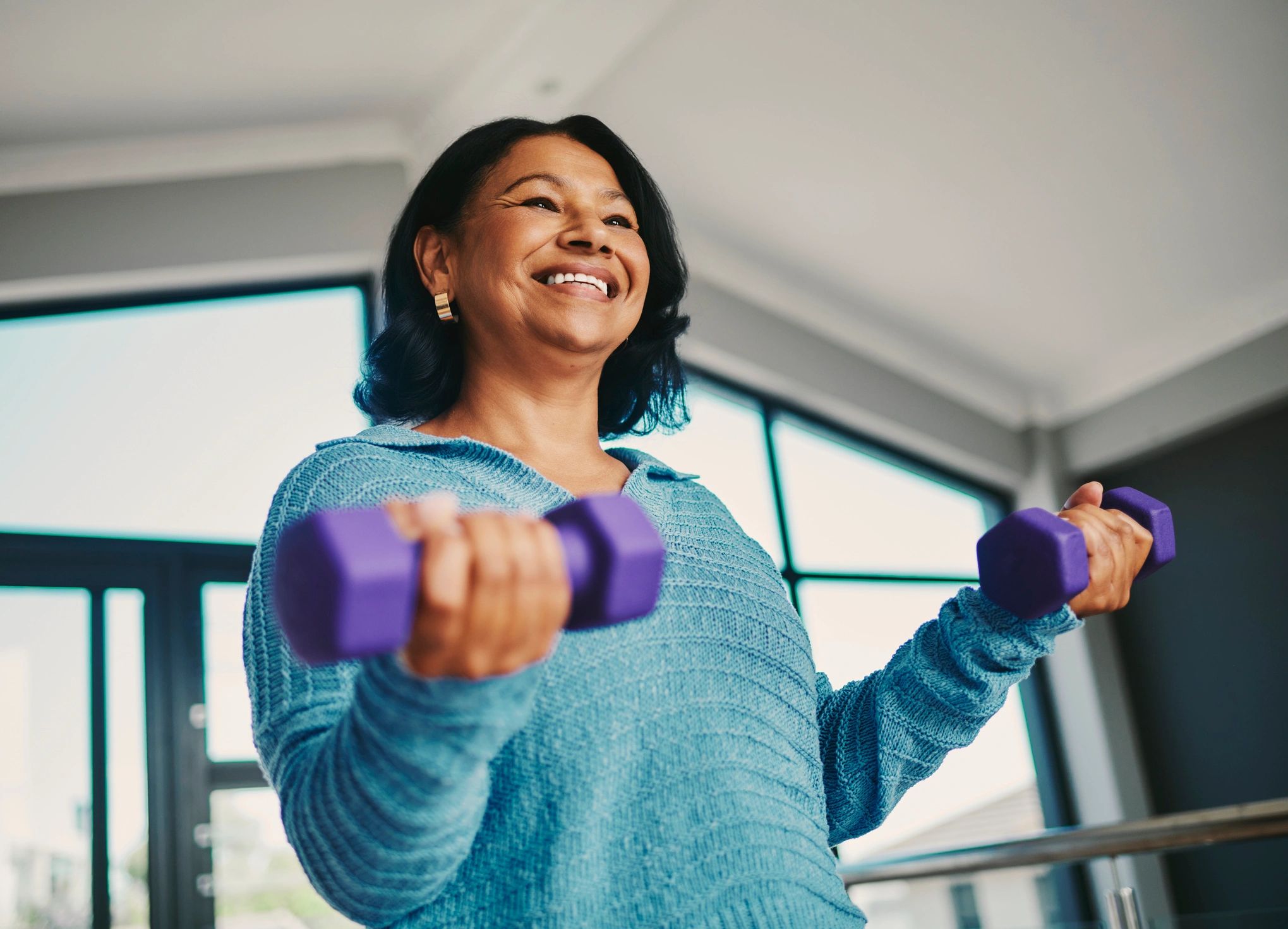 Client doing strength training with dumbbells